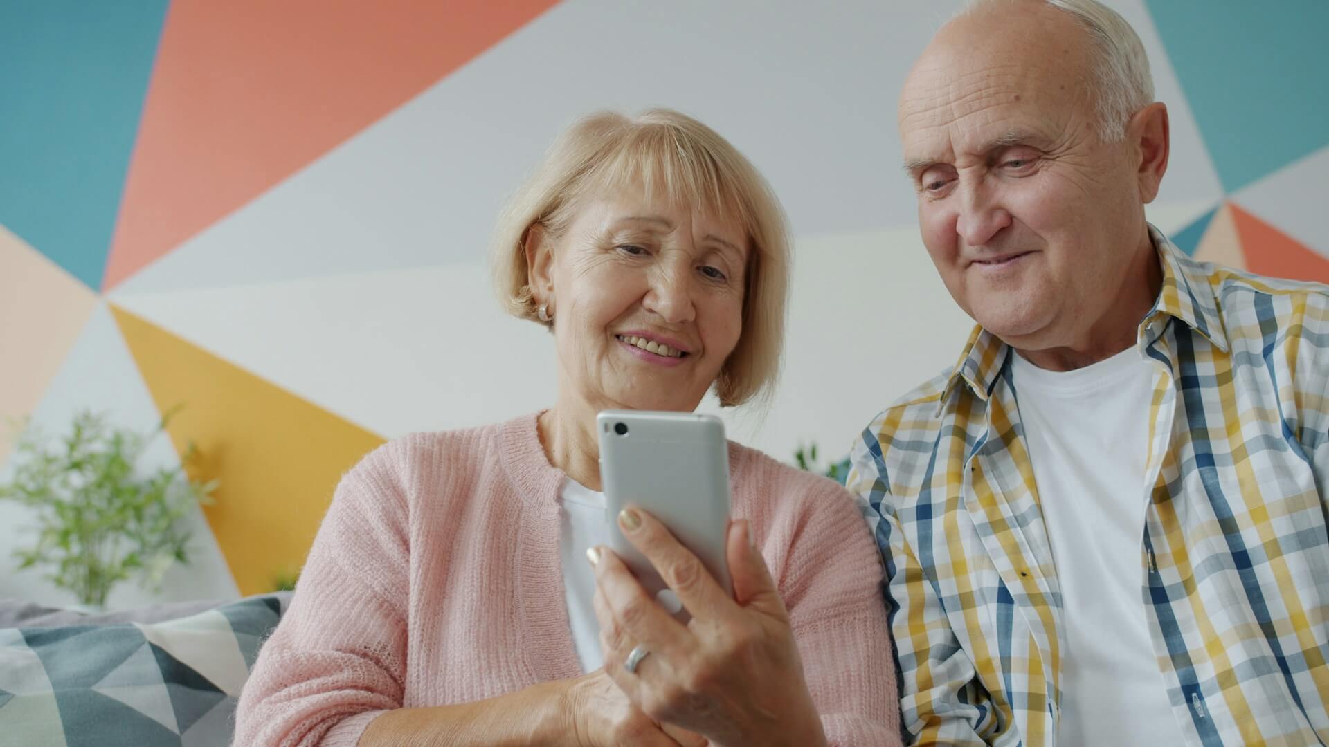Elderly couple using smartphone